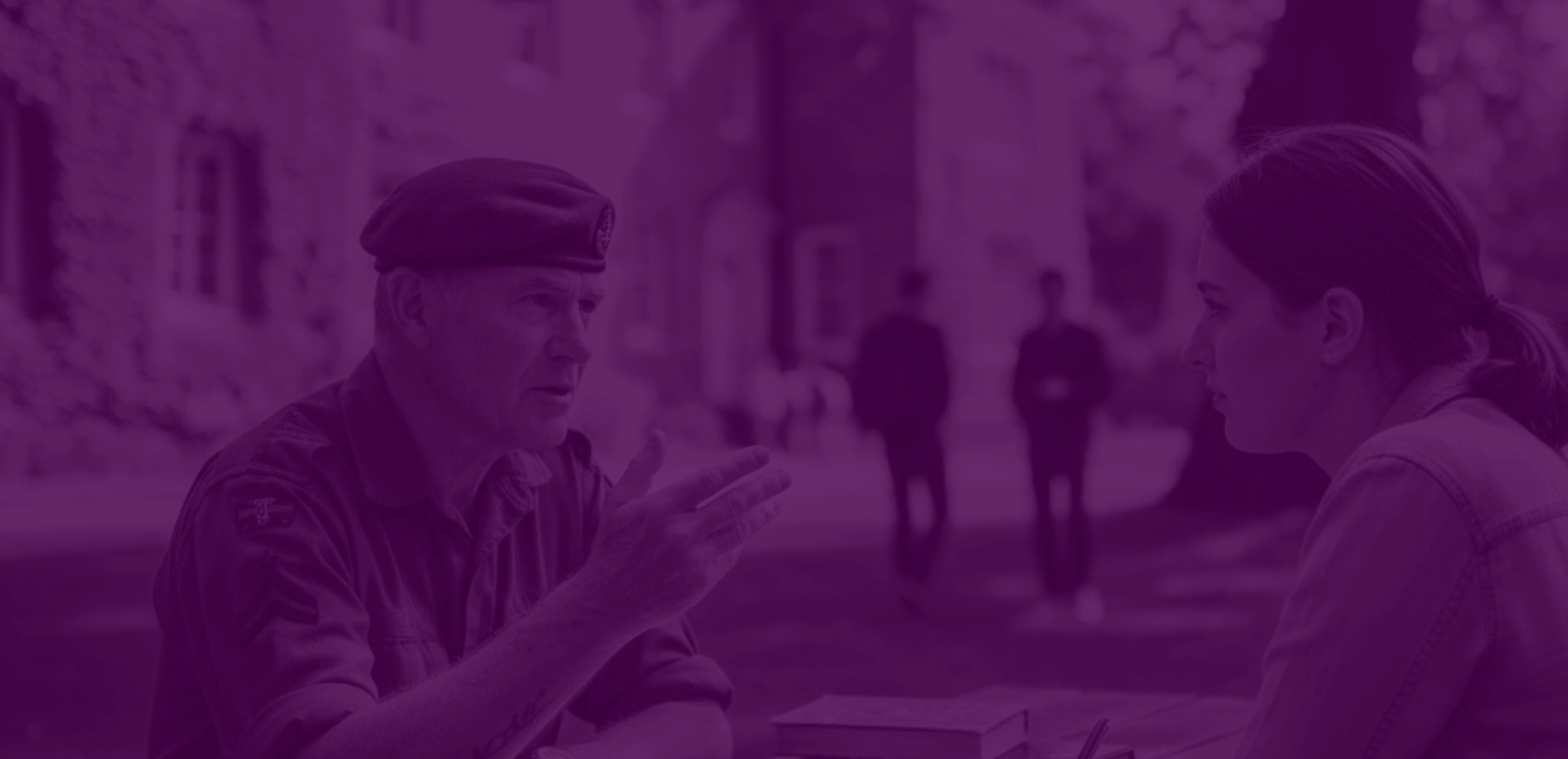 A member of the armed forces discussing experiences with a researcher during an interview or study session.