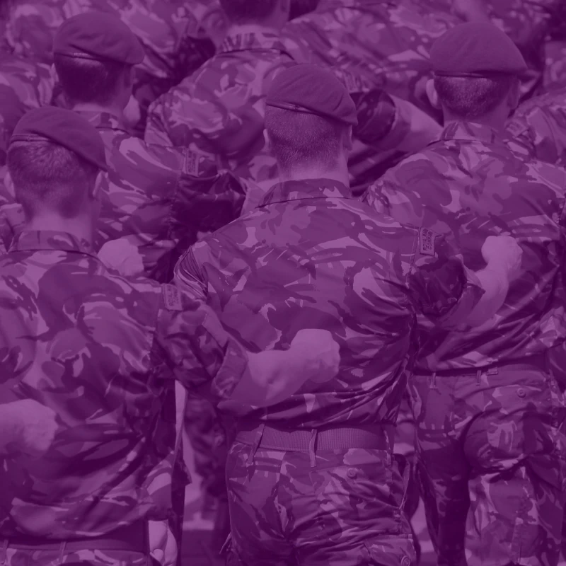 Military personnel in uniform marching.